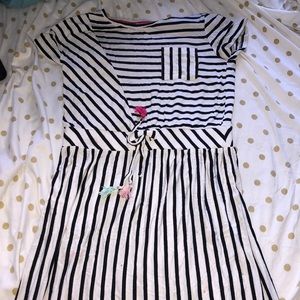 Hey guys so today I am selling a white dress with black stripes and pink